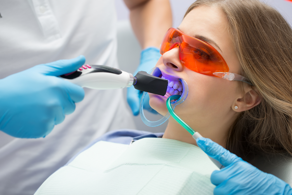 Woman having Teeth Whitening procedure